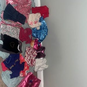 a ton of american girl brand doll clothing! PLUS sleeping bag!